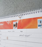 A3 wall calendar hung with a self-adhesive hook